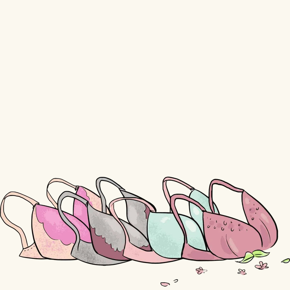 Colorful teapots arranged in a row on a white background